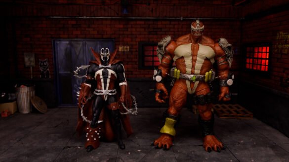 Monolith junto a una figura de Spawn con capa, mostrando la diferencia de tamaño.